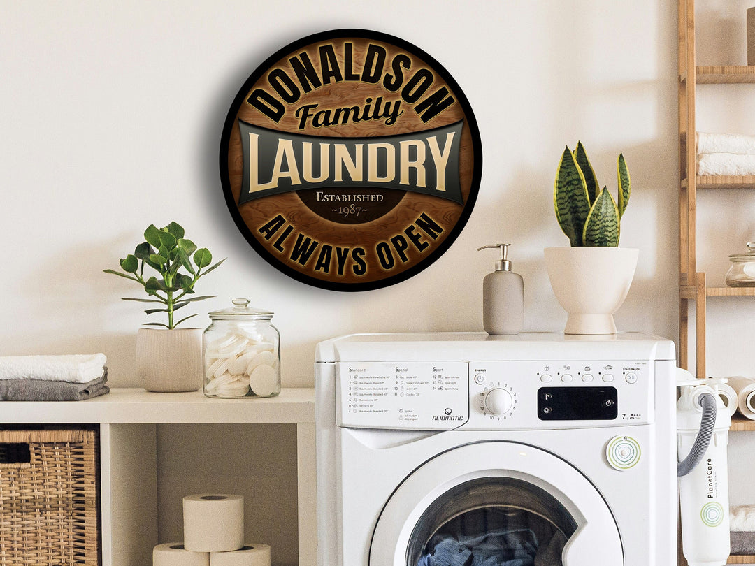 Round, wooden Laundry Sign personalized with your family name and established year.